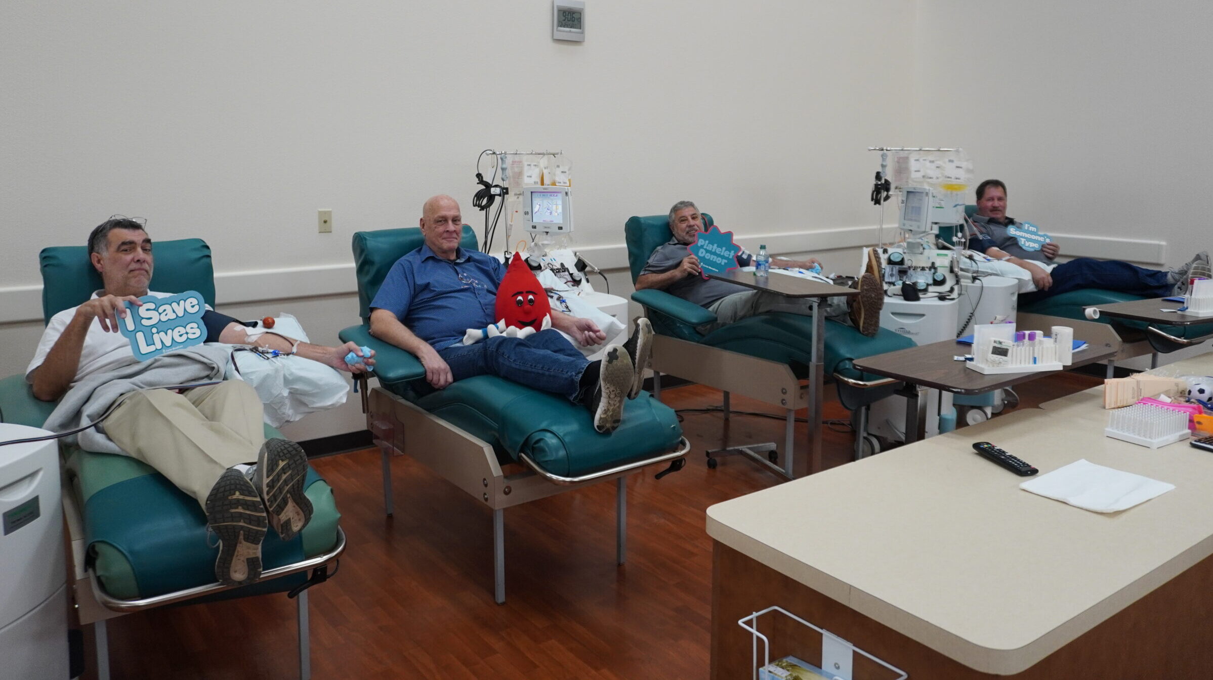 Photo of four men donating platelets with Carter BloodCare