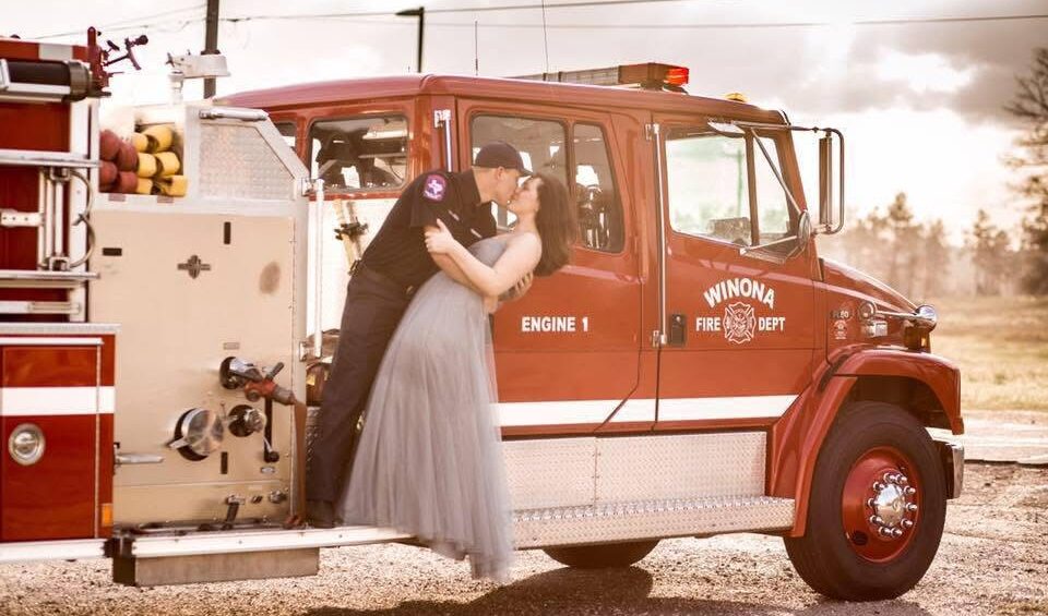 Caitline Picler and husband wedding photo on firetruck